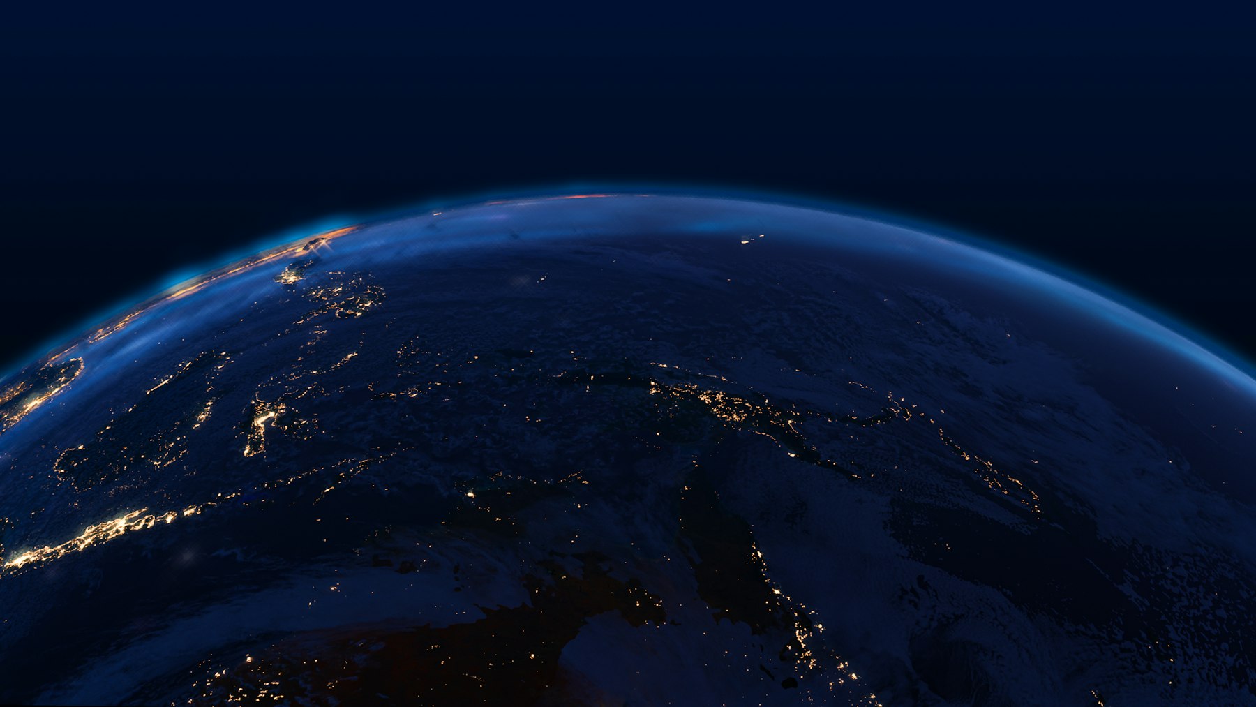 The Earth seen from space, a thin lit crescent against the dark